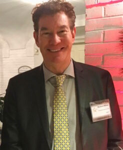 Photo of Richard Killian. Richard Killian combines strategic financial planning with practical operations, helping organizations improve reporting accuracy, strengthen internal controls, and make better financial decisions. Photo located inside of a business event. Richard Killian is wearing a suit with a name tag. 